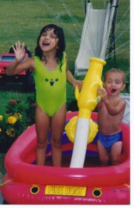 elise and jacob playing in kiddie pool